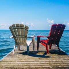 Red and white chairs on dock