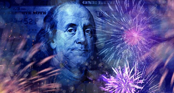Close up American one hundred dollar bill and fireworks