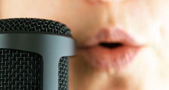 Close up of female singer and microphone