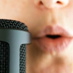 Close up of female singer and microphone