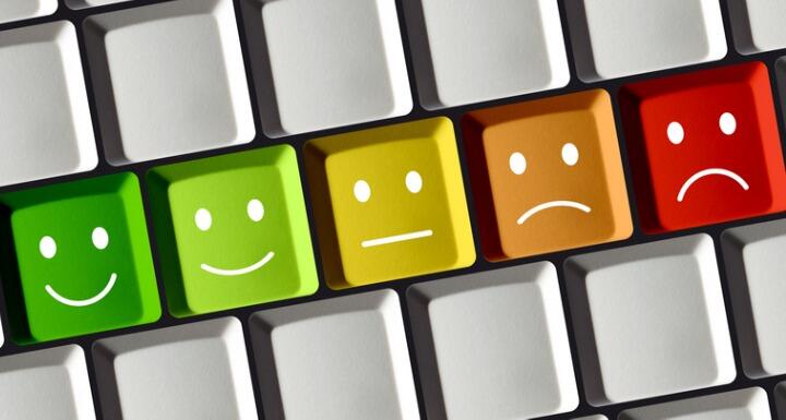 Computer Keyboard with colored keys showing positive and negative emotion from red over yellow to green