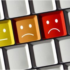 Computer Keyboard with colored keys showing positive and negative emotion from red over yellow to green