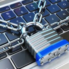 A padlock on a computer keyboard for data security