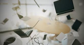 Concept of chaos in the office with flying objects