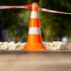 Orange construction cone with tape