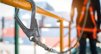 Construction worker in safety harness