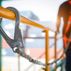 Construction worker in safety harness