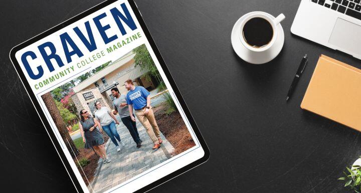 Cover of Craven Community College Magazine on a Tablet that sitting on a desk