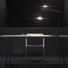 Dark interrogatin room with light and chair
