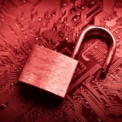 Open lock on top of computer motherboard signifying data breach