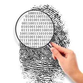 Magnifying glass close of a finger print with binary code