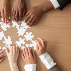 Diverse Group putting together a puzzle