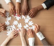 Diverse Group putting together a puzzle