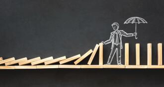 Domino Effect and Business Challenge Concept with Hand Drawn Chalk Illustrations on Blackboard