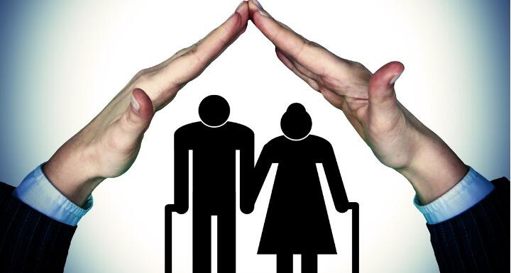 an outline of a man and a woman with canes sheltered under a woman's hands