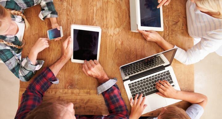 Family using new technology, overhead view