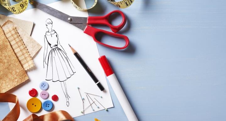 Fashion design background with sketch and sewing equipments
