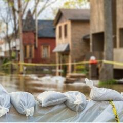 Flooded neighborhood with sandbags