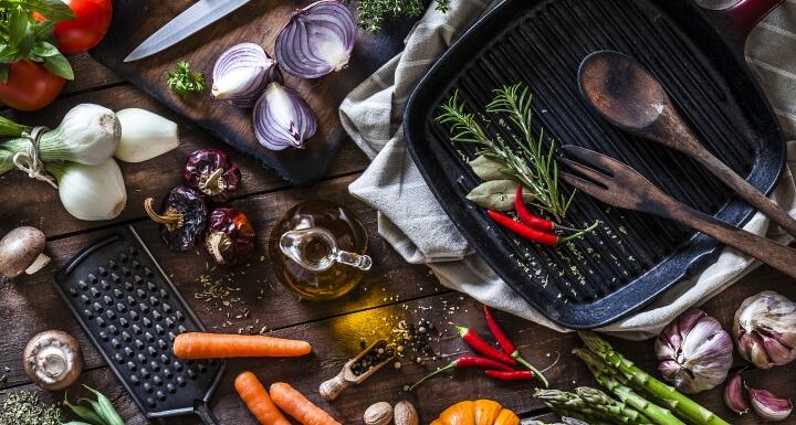 Fresh vegetables ready for cooking shot on rustic wooden table