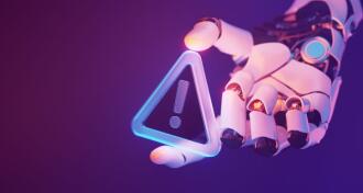 Robotic hand holding glowing warning sign