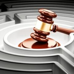 Gavel inside labyrinth maze