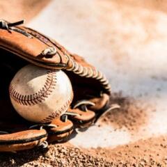 Glove and ball on home plate