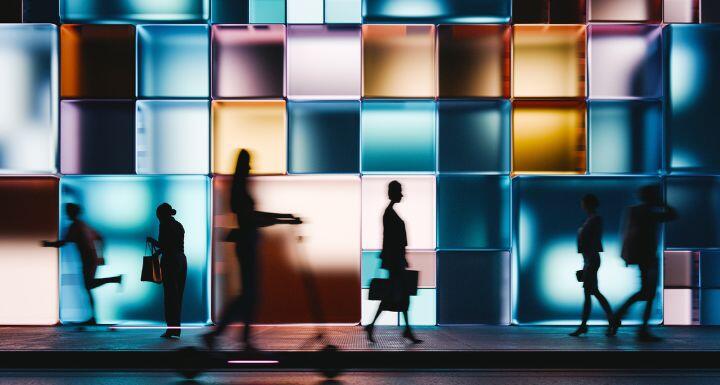 Glowing building with people in background