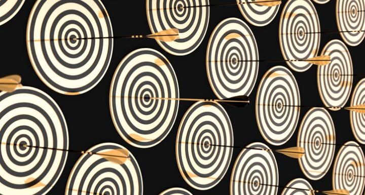 Gold targest with arrows on the bullseye