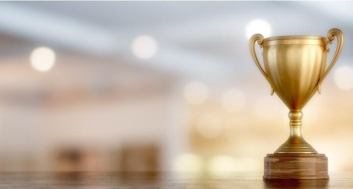 Gold trophy standing out against blurred background
