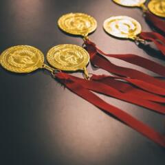 Gold medals with red ribbons