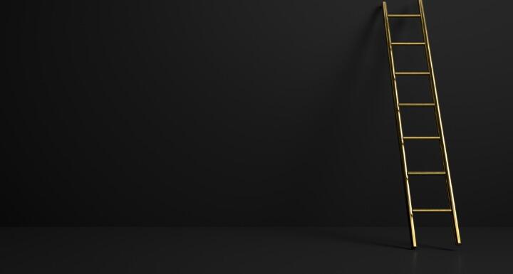 golden stepladder on black background