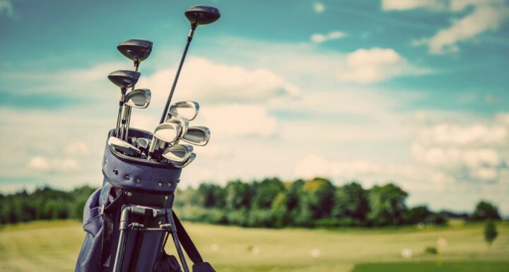 Golf bag on golf course on sunny day