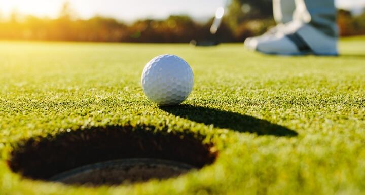 Golfer putting ball