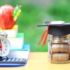 Graduation Hat on glass bottle with books