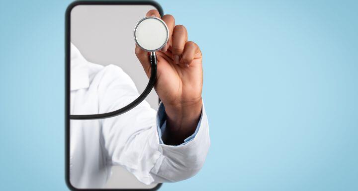 Hand of black woman doctor in white coat listen breath with stethoscope on smartphone-MAIN