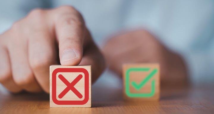 Hand push red Red Cross mark to choose cancellation item