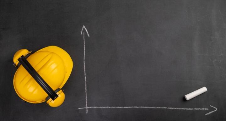 Hard hat on chalkboard with blank chart drawing