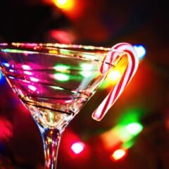 Martini glass with holiday lights and candy cane