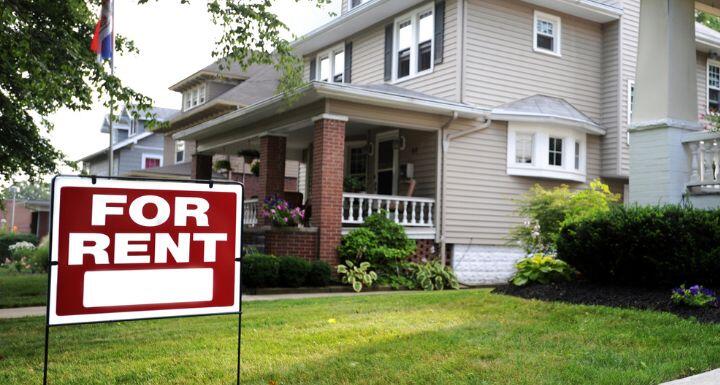 Sign “For rent” in front of the house