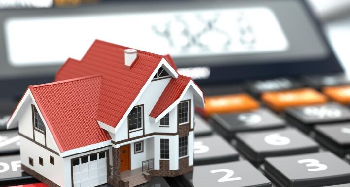 Rendering of house on top of a calculator