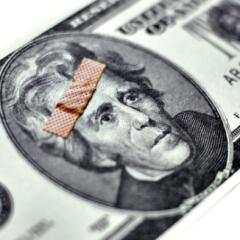 Money with bandaid