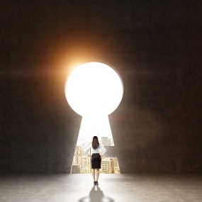 woman standing in front of a keyhole