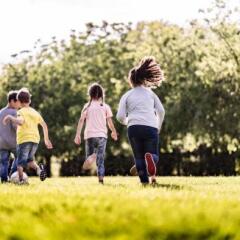 Kids Playing Soccer in a field