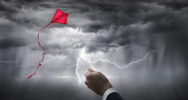 Kite flying in storm with lightning