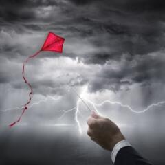 Kite flying in storm with lightning