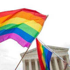 LGBTQ rainbow flag flying in front of Supreme Court building