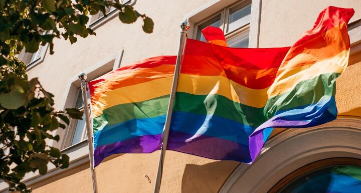 LBTQ+ flags flying in front of a business