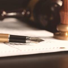 Law notary fountain pen and paper on desk