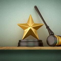 Legal Gavel with Golden Star on Shelf