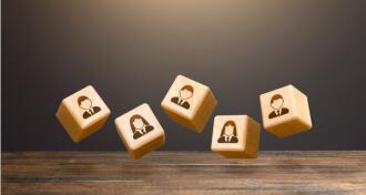 Levitating blocks with employees on a dark background